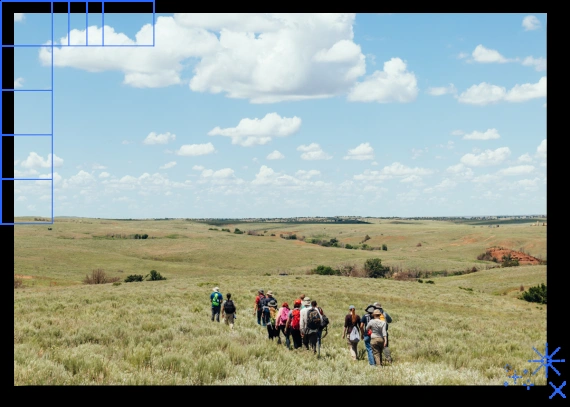 Kansans walking together through the Flint Hills prairie